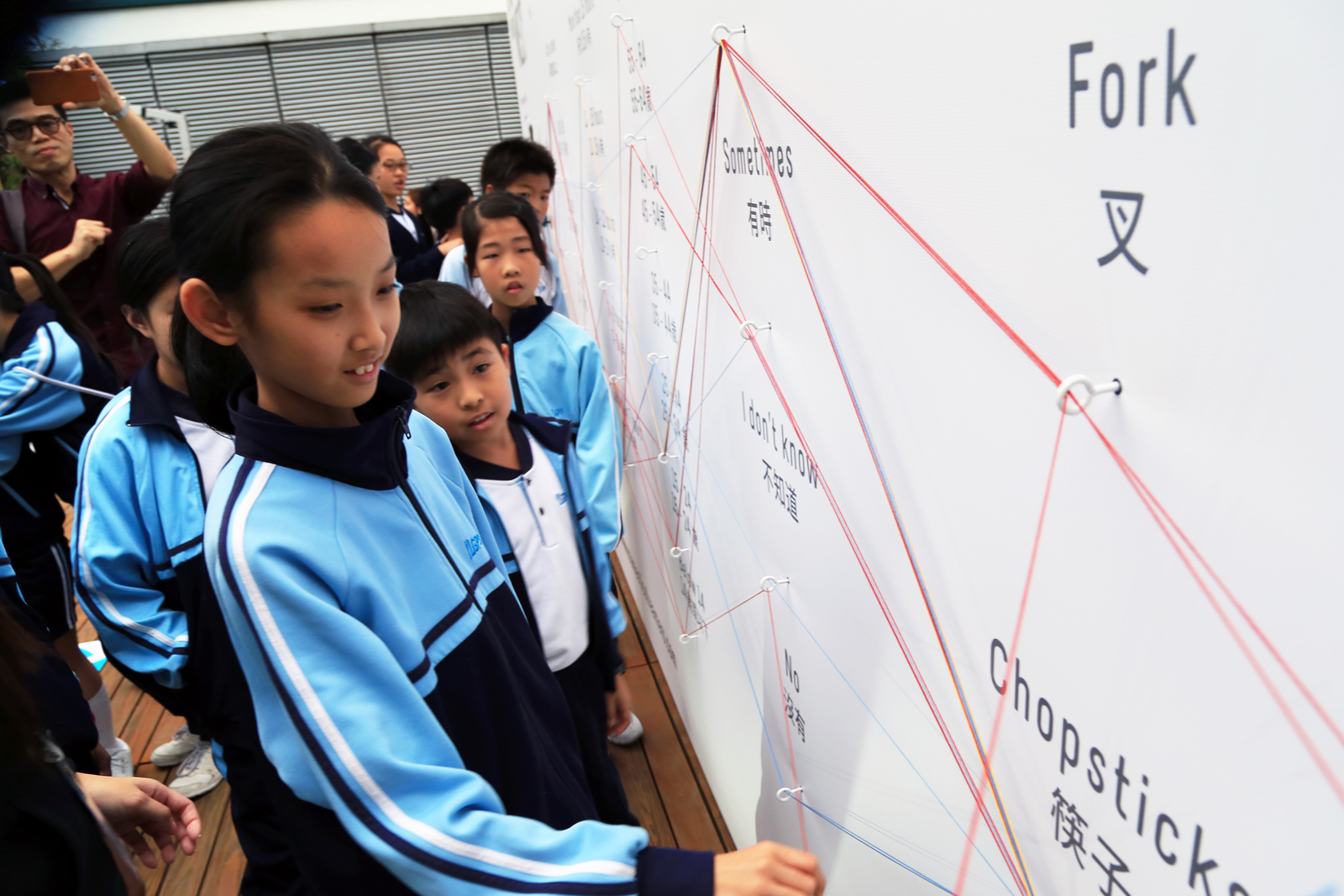 Children interacting with a Data Strings installation